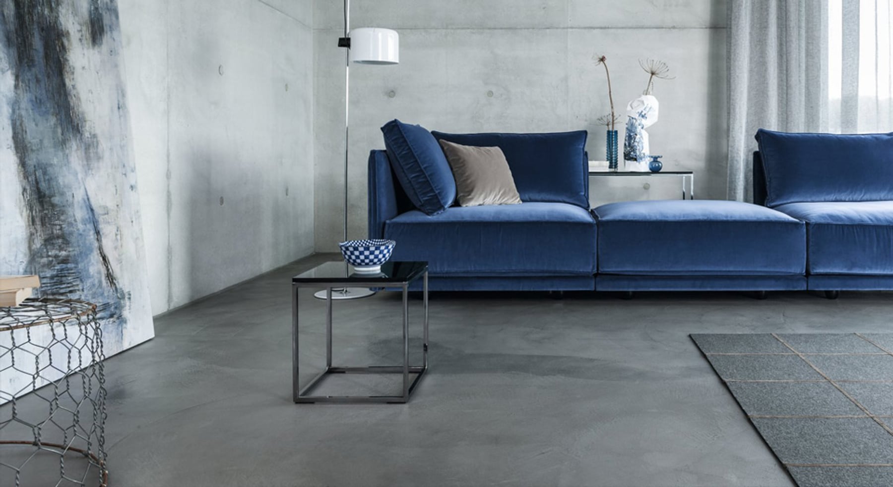 Wohnzimmer mit Betonboden – Designboden Malerbetrieb Pagel
